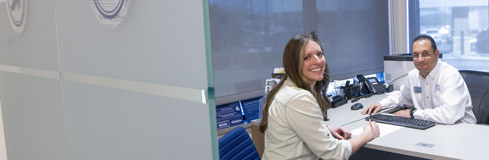 WPCU Member sitting with a Financial Coach