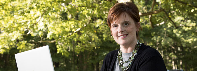 Women working on a computer outside