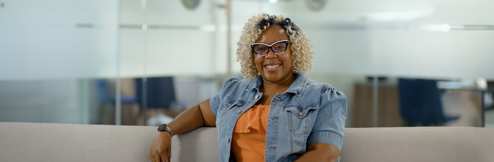 Photo of female member sitting in a Member Center