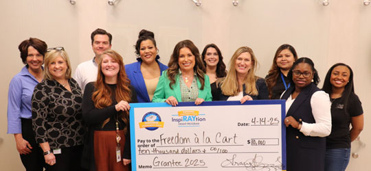 SCF InspiRAYtion Grantee with SCF team and large check