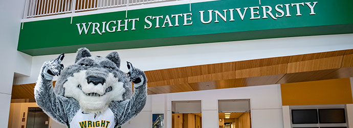 Rowdy the Raider standing underneath WSU name