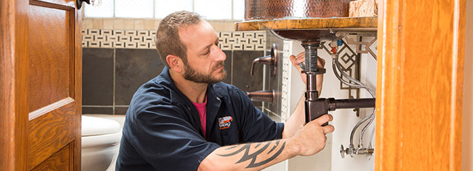 Plumber fixing a sink