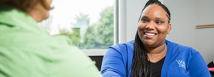 WPCU Partner Employee working with a member