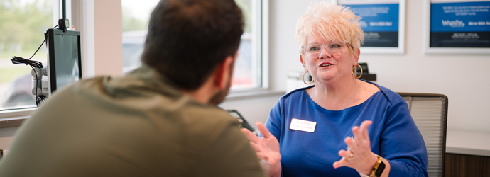 WPCU partner at a desk with a member