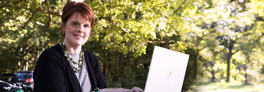 Amy B. working on her laptop