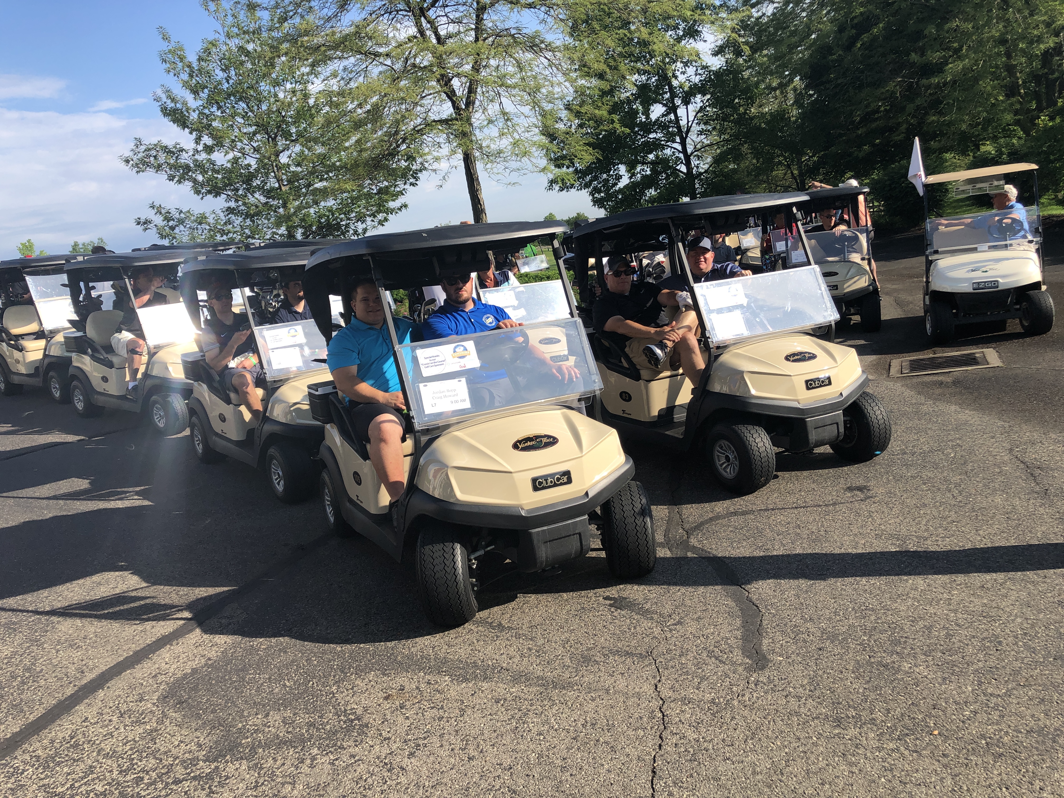 Golfers riding on golf carts during the WPCU Golf Outing